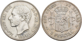 ALFONSO XII. 2 pesetas. 1881*18-81. Madrid. MSM. AR 9,93 g. 27,1 mm. VII-71. Ligeramente abrillantada. MBC.