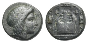 IONIA. Kolophon. Circa 389-350 BC. Bronze (Bronze, 12 mm, 1.88 g). Head of Apollo to right, with hair bound with taenia. Rev. Lyre within linear squar...