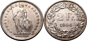 SWITZERLAND. 
Silver 2 francs, 1904. 
Dies by Antoine Bovy. Obv: Figure of Helvetia standing left, holding spear and supporting coat of arms of Swit...