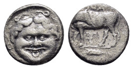 MYSIA. Parion.(4th century BC).Hemidrachm.

Obv : ΠΑ / ΡΙ.
Bull, with head right, standing left on ground line; star below.

Rev : Facing gorgoneion w...