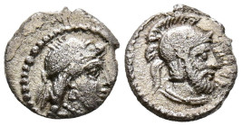 CILICIA, Tarsos. Obolo. (Ar. 0,56g/9mm). 378-372 a.C. (SNG BnF 278-281). Anv: Cabeza diademada femenina a derecha. Rev: Cabeza barbada masculina con c...
