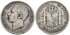 ALFONSO XII (1874-1885). 1 Peseta. (Ar. 4,85/23mm). 1882 *18-82. Madrid MSM. (Cal-2019-20). BC+. Escasa.