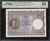 CEYLON. Government of Ceylon. 50 Rupees, 1945. P-37a. PMG Choice Very Fine 35.
Serial number K/8 08803. Purple and multicolour, George VI at left. A ...