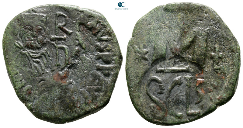 Heraclius AD 610-641. overstruck on a follis of Justinian I. Syracuse
Follis or...