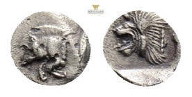 Mysia, Kyzikos. AR Hemiobol, . Circa 450-400 BC.
Obv: Forepart of boar left; to right, tunny upward.
Rev: Head of roaring lion left; star to upper lef...