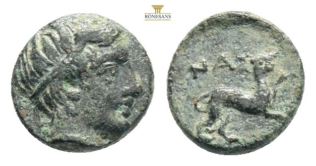 LESBOS. Nesos. Ae (4th century BC). 0,72 g. 8,3 mm. Obv: Laureate head of Apollo...