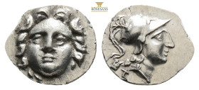 PISIDIA. Selge. Ca. 4th century BC. AR obol (0,86 g. 12,6 mm, ). NGC AU. Head of gorgoneion facing with flowing hair / Head of Athena right, wearing c...