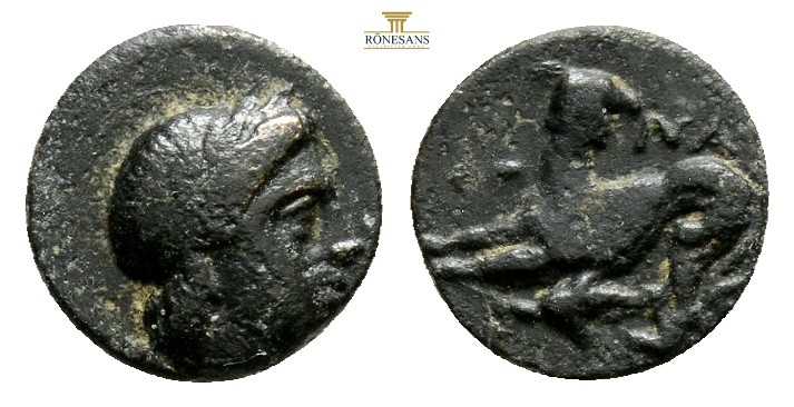 LESBOS. Nesos. Ae (4th century BC). 0,64 g. 9,3 mm. Obv: Laureate head right. Re...