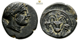 BITHYNIA. Kios. Ae (3rd century BC). 3,1 g. 14,8 mm.
Obv: Head of Mithras right, wearing a laureate tiara.
Rev: K-I. Kantharos with two grape vines wi...