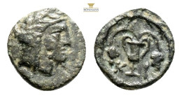 Greek Coins MYSIA. Kisthene. Ae. 1,2 g. 11,7 mm.
Obv: Laureate head right.
Rev: Kantharos between two bunches of grapes; all within wreath.