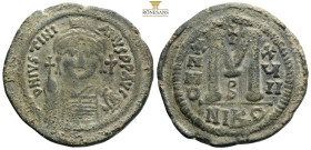 Justinian I. 527-565. Æ Follis (33,4 mm, 18,2 g, ). Nicomedia mint, year 15 = 541/2. DN IVSTINIANVS PP AVG, helmeted and cuirassed bust facing, holdin...