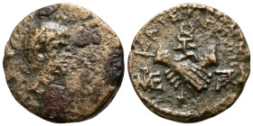 LYDIA. Tralles. Octavian, 30 BC. (Bronze, 17 mm, 3.41 g, 12 h), Menandros Parrhasiou. Bare head of Octavian to right. Rev. ΚΑΙΣΑΡΕΩΝ Clasped hands hol...