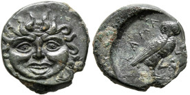 SICILY. Kamarina. Circa 420-405 BC. Onkia (Bronze, 17 mm, 1.37 g, 3 h). Facing gorgoneion. Rev. ΚΑΜΑ Owl standing right, head facing, holding lizard i...