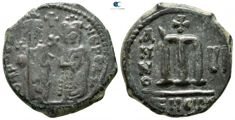 Phocas, with Leontia AD 602-610. Theoupolis (Antioch)
Follis Æ

25mm., 9,64g....