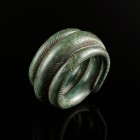 Late Bronze Age Ring
10th-8th century BCE
Bronze, 41 mm
Massive cast. Decorated by carved lines. 
Very fine condition.
Ex. Coll. M.D., acquired a...