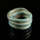 Late Bronze Age Ring
10th-8th century BCE
Bronze, 30 mm
Massive cast. Decorated by carved lines. 
Very fine condition.
Ex. Coll. M.D., acquired a...