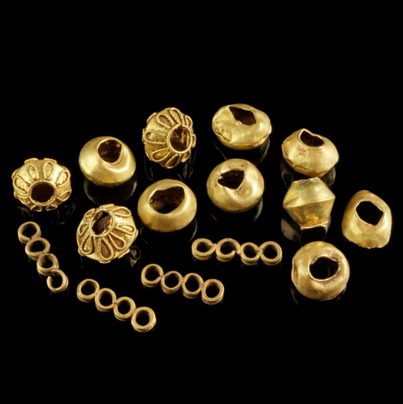 Ancient Gold Beads
Roman/Byzantine
Gold, 6-8 mm, 6,55 g total
Probably parts ...