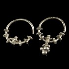 Byzantine Pair of Silver Earrings
12th-15th century CE
Silver, 48 mm, 19,20 g total

Very fine condition. One pendant is missing.
Ex. Coll. M.D.,...
