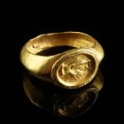 Roman Gold Ring
2nd-3rd century CE
Gold, 20 mm, 17 mm internal diameter, 4,00 g
Intact and wearable. Showing clasped hands surrounded by a twisted ...