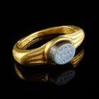 Roman Gold Intaglio Ring
2nd-3rd century CE
Gold, Agate, 23 mm, 14-18 mm internal diameter; 7,32 g
Intact and wearable. Engraved with a three-lined...