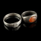 2 Roman Silver Rings
1st-4th century CE
Silver/Carnelian, 20-23 mm, 16-20 mm internal diameter
Intact and wearable.
Very fine condition.
Ex. Coll...