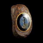 Roman Nicolo Intaglio Iron Ring
1st-3rd century CE
Iron, Nicolo, 30 mm
Large military ring with an embedded nicolo intaglio showing a nude young ma...