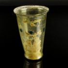 Late Roman Glass Cup
4th century CE
Greenish Glass, 105 mm
Intact. Dark blue dot decoration.
Very fine condition. Traces of sinter.
Ex. Coll. B.K...