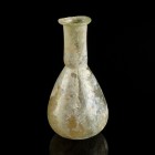Roman Glass Bottle
1st-4th century CE
Glass, 82 mm
Intact. 
Very fine condition.
Ex. Coll. M.D., acquired at the european art market.