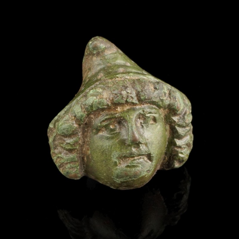 Roman Face Mount
2nd-4th century CE
Bronze, 27 mm
Showing the face of a young...