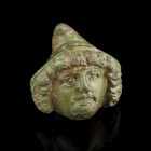 Roman Face Mount
2nd-4th century CE
Bronze, 27 mm
Showing the face of a young male, wearing a phrygian cap. Detailed work!
Fine condition.
Ex. Co...