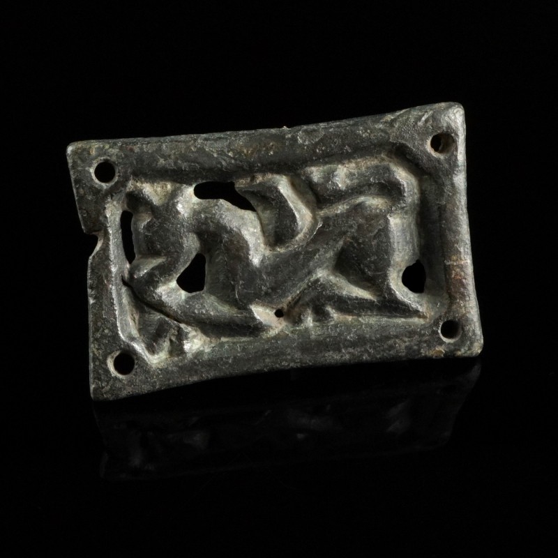 Avar Belt Mount
8th century CE
Bronze, 34 mm
Intact belt mount, depicting a g...