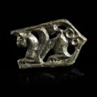 Avar Strap End
8th century CE
Bronze, 41 mm
Broken front part of a strap end, depicting a griffin.
Very fine condition.
Ex. Coll. M.D., acquired ...
