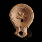 Roman Oil Lamp with Dolphin
1st-2nd century CE
Clay, 73 mm
Showing a figure(?) riding on a dolphin.
Fine condition. Some incrustations.
Ex. Coll....