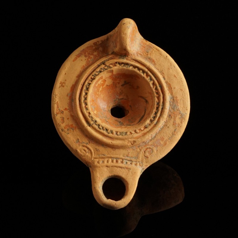 Roman Oil Lamp
1st-3rd century CE
Clay, 85 mm
Showing ornaments.
Fine condit...