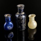 Three Glass Bottles
Ancient-Modern
White/Blue Glass, 30-55 mm

Very fine condition. Traces of sinter.
Ex. Coll. B.K., acquired at the european ar...