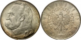 II RP. 10 zlotych 1939 Pilsudski
Znakomicie zachowana moneta z piękną patyną zachodzącą od rantu i połyskiem menniczym. Egzemplarz w polskim gradingu...