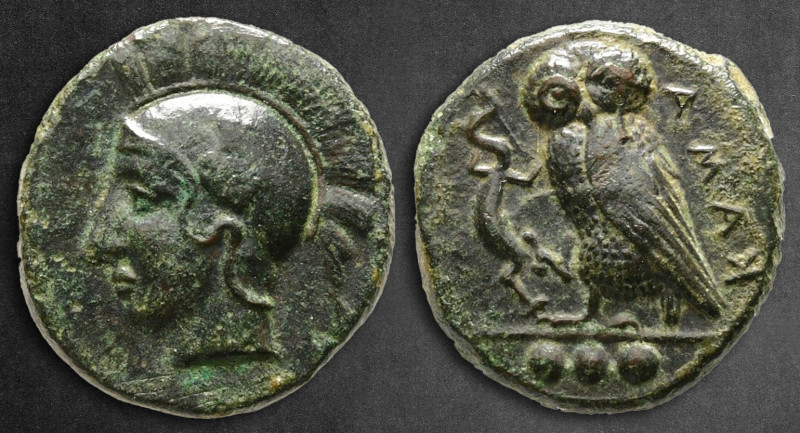 Sicily. Kamarina circa 420-405 BC. 
Tetras Æ

15 mm, 3,44 g

Head of Athena...