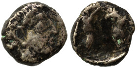 PHOENICIA. Uncertain. 4th century BC. 1/16 Shekel (silver, 0.61 g, 7 mm). Laureate head of Ba'al-Arwad to right. Rev. Persian king standing right, wit...