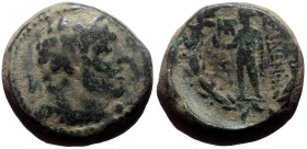 Bronze Æ
Lydia, Sardeis, Laureate head of Herakles right within dotted border / Apollo standing left, holding bird and olive branch
16 mm, 6,62 g