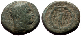 Bronze Æ
Lydia, Sardeis, Laureate head of Herakles right within dotted border / Apollo standing left, holding bird and olive branch
16 mm, 4,28 g
