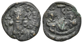 Arab-Byzantine, Umayyad Caliphate, Uncertain mint 685-692. Fals circa 685-690, Æ 19.61 mm, 3.70 g.
About VF