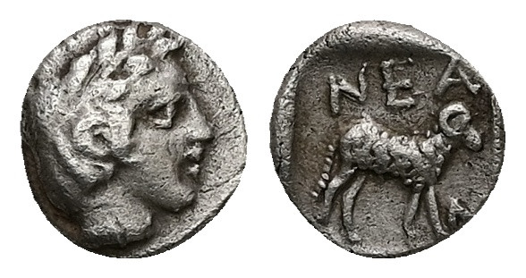 Troas, Neandria. AR Hemiobol, 0.60 g 8.58 mm. 4th century BC.
Obv: Laureate head...