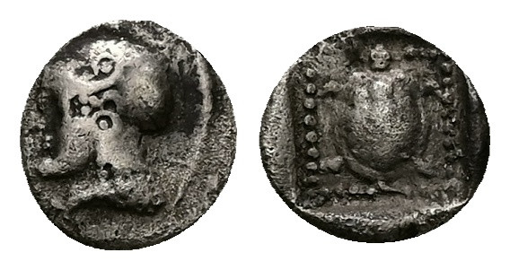 Lesbos, Methymna. AR Obol, 0.44 g 8.27 mm. Circa 500-440 BC.
Obv: Helmeted head ...