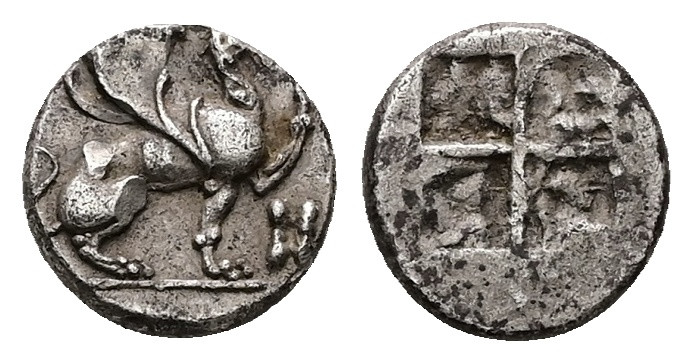 Ionia, Teos. AR Diobol, 1.36 g 10.12 mm. Circa 510-490 BC.
Obv: Griffin seated t...