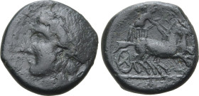 Sicily, Syracuse. Time of Hiketas II, 287-278 BC. Æ (6.32g, 18mm, 9h).Wreathed head of Persephone to left; [ΣΥΡΑΚΟΣΙΩΝ] before R/ Charioteer driving f...