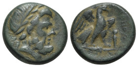 Lydia, Tralleis, c. 2nd-1st century BC. Æ (21mm, 10.13g, 12h). Laureate head of Zeus r. R/ Eagle standing r. on thunderbolt, wings spread; herm before...