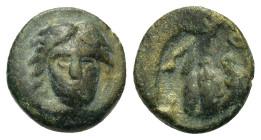 Islands off Caria, Rhodes, c. 400 BC. Æ 11 (1,60g.). Head of Helios facing, inclined slightly to right. R/ P O, rose, with a bud on right and bucraniu...