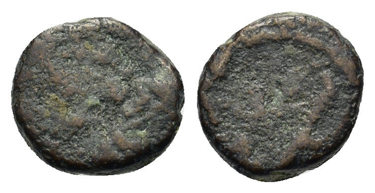 Uncertain Late Roman Æ with monogram (8mm, 0.56g).