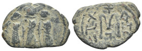 Arab-Byzantine, Umayyad Caliphate, 7th century. Æ Fals (28mm, 6.02g, 6h). "Pseudo-Byzantine" issue. Three standing figures, each holding globus crucig...