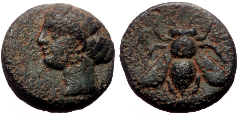 Ionia, Ephesos AE (Bronze, 1.19g, 11mm) 375-325 BC.
Obv: Female head (Artemis?) ...